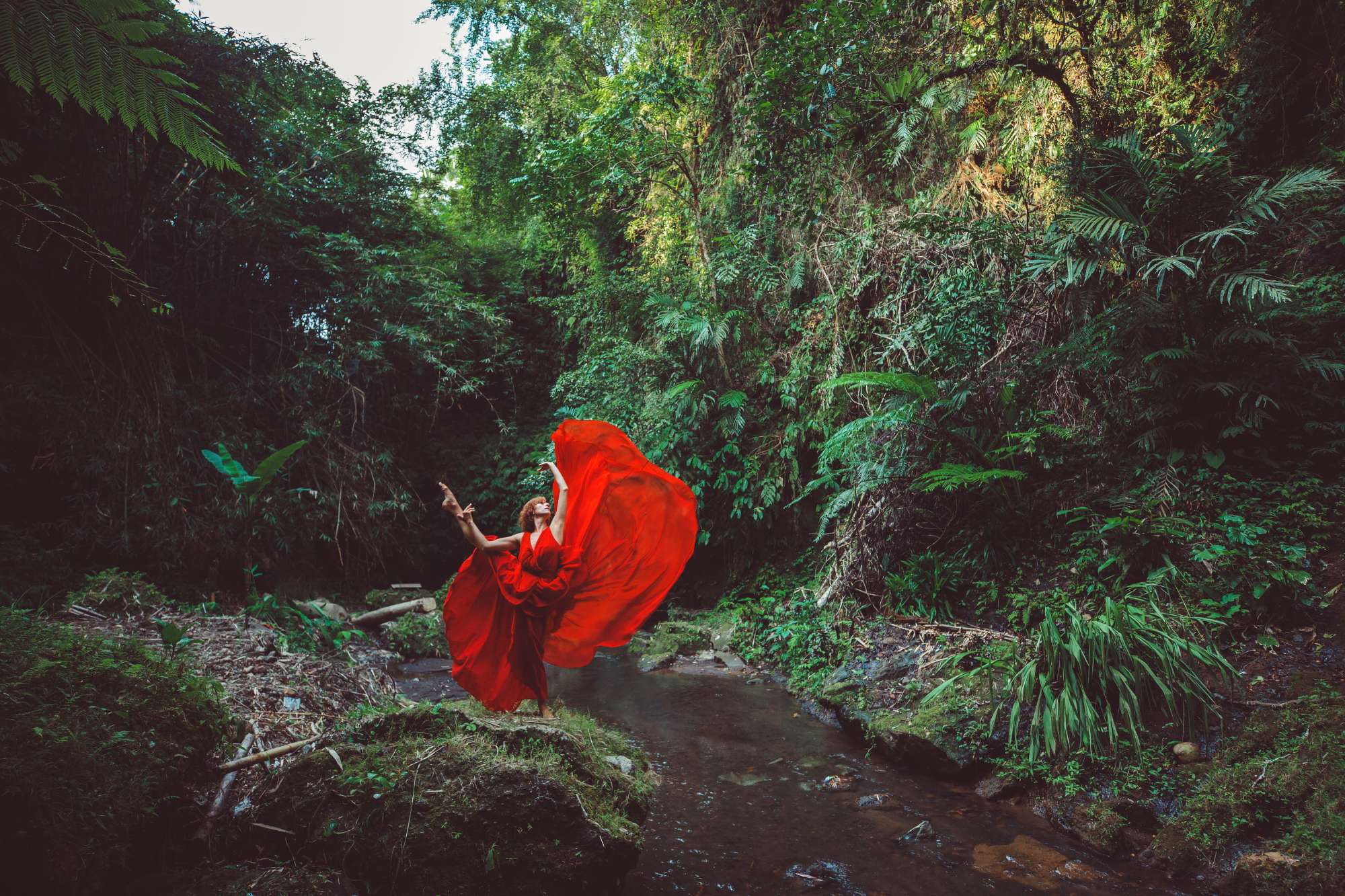 girl-red-dress-dancing-waterfall.jpg